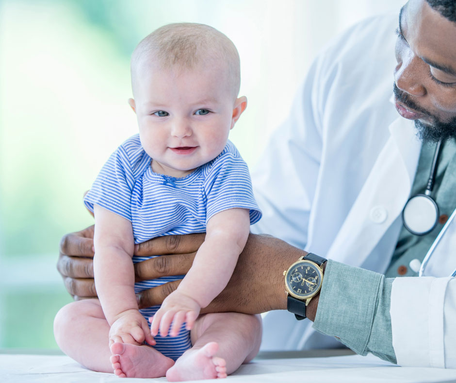 A doctor holding a baby.