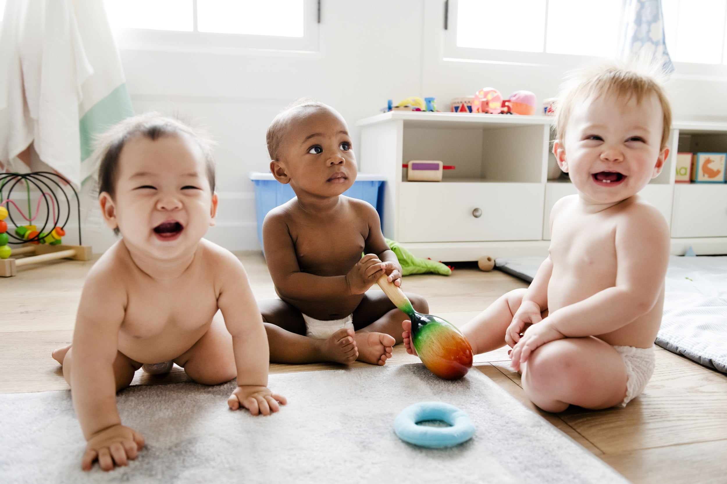 A group of babies playing.