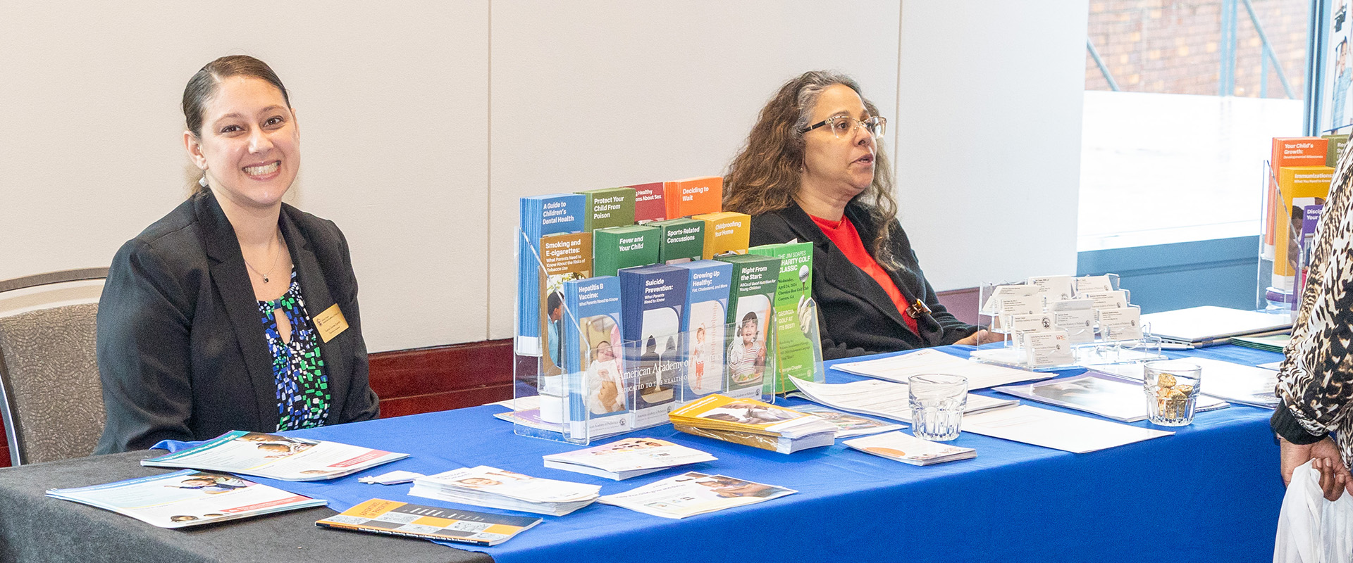 GAAAP members at a booth providing learning information.