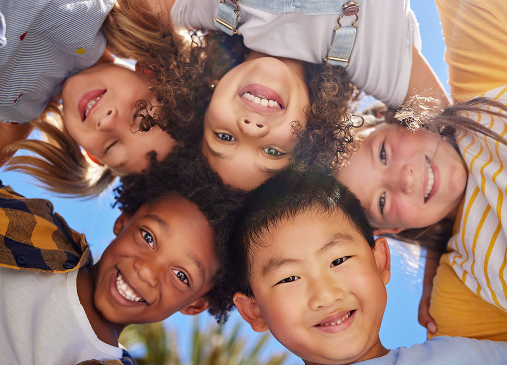 A group of kids smiling.
