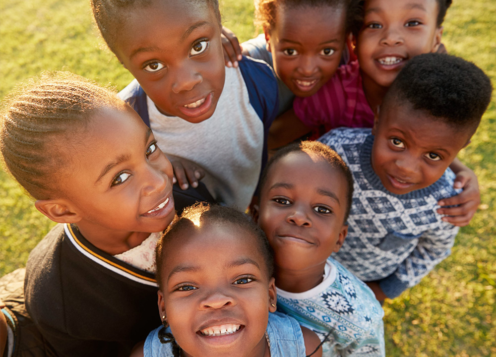 A group of children smiling.