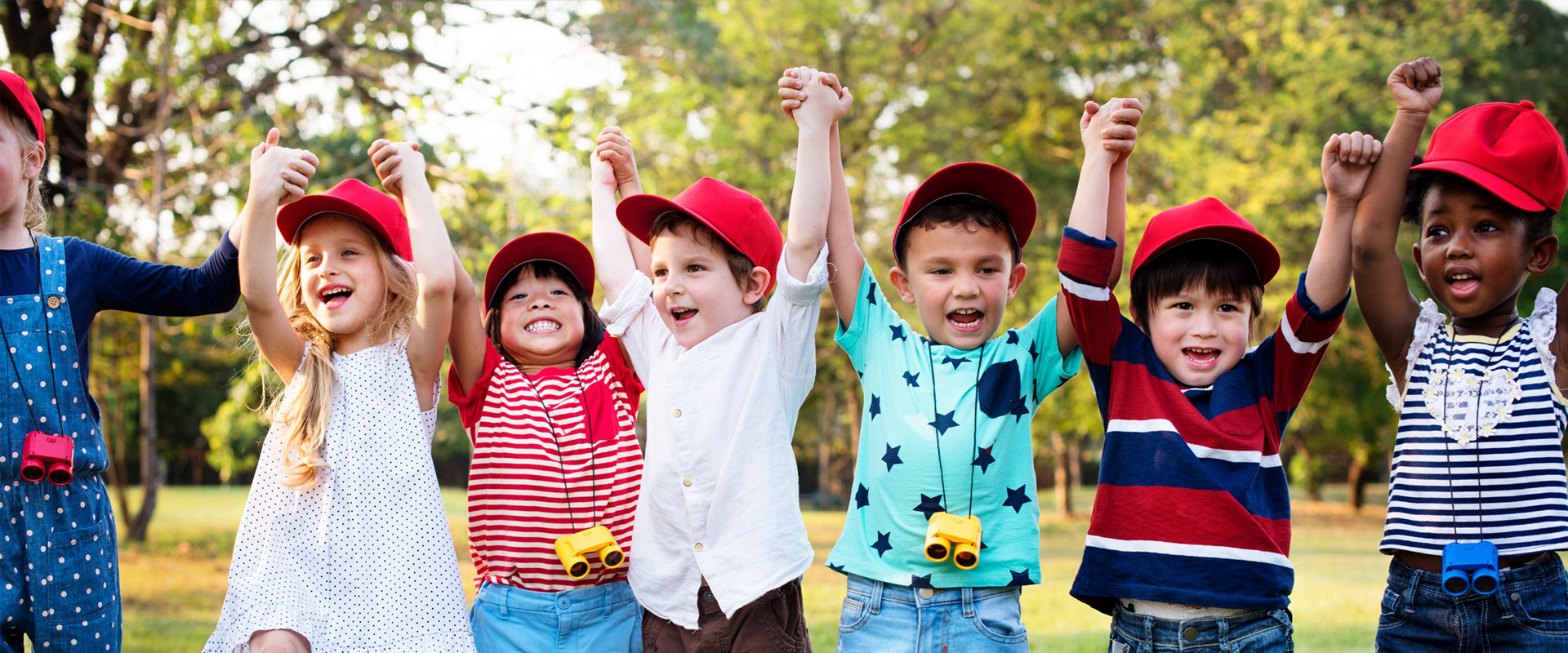 Kids holding hands and cheering