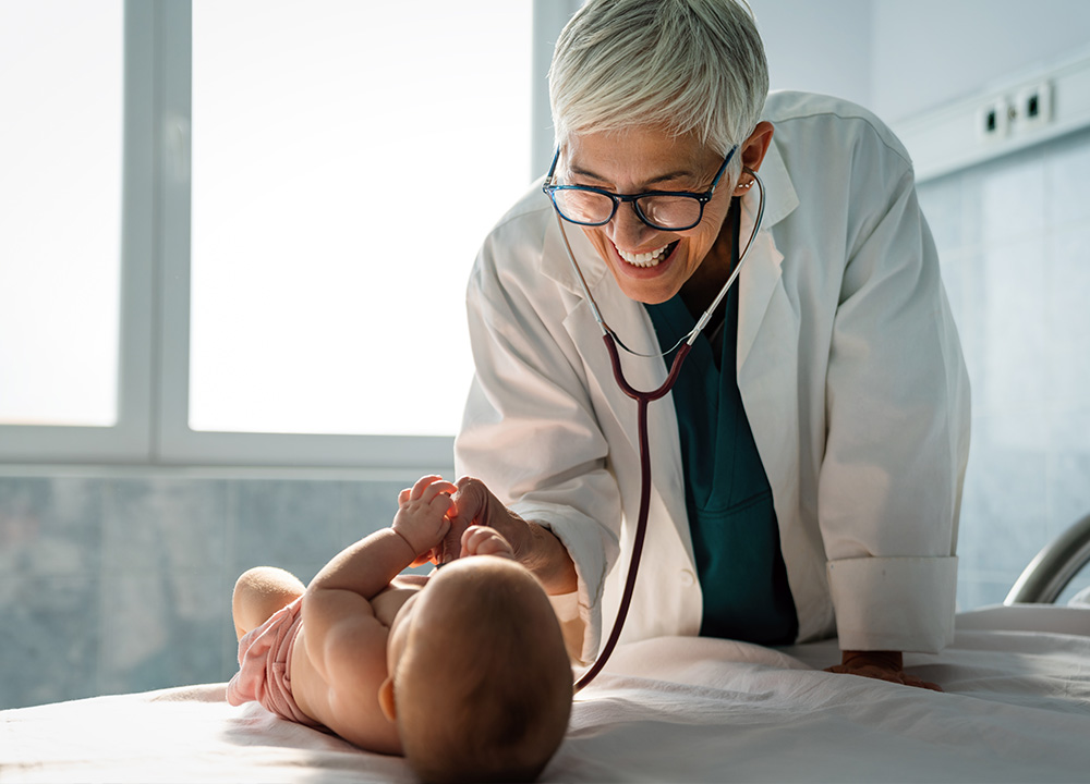 A doctor performs a checkup on a baby.