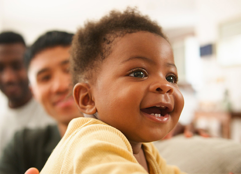 A cute baby smiling.