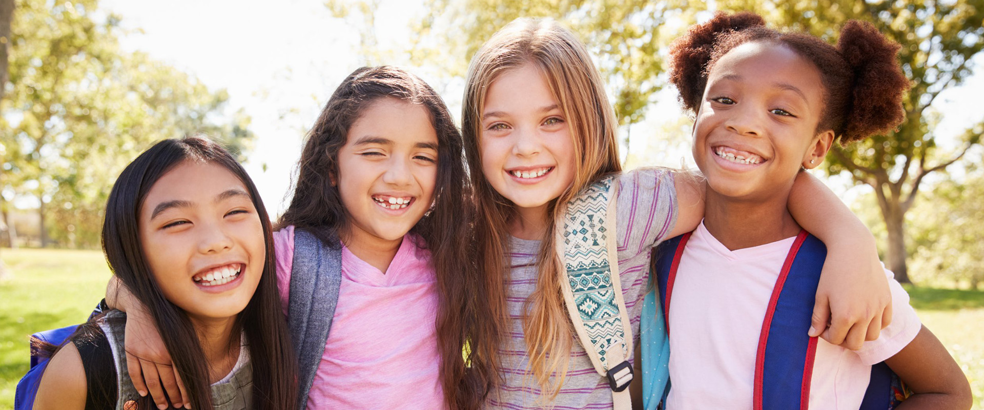A group of schoolgirls smiling.