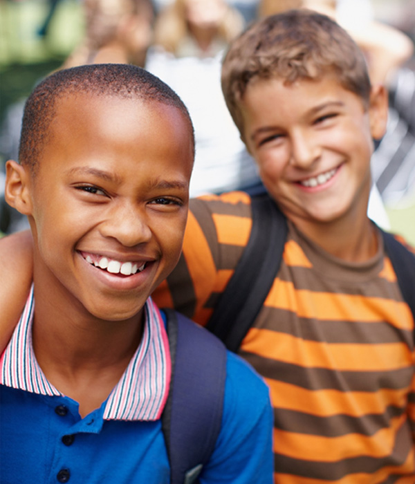 Two schoolboys smiling