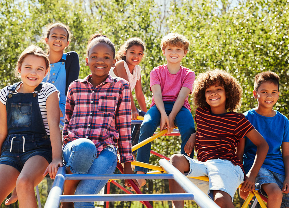 A group of schoolchildren on a playground.