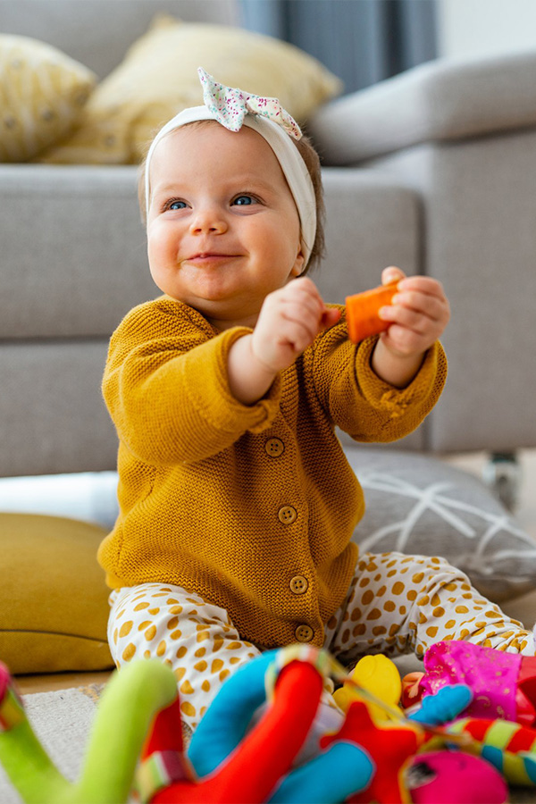 A baby playing with toys.