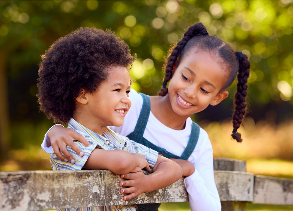 Two children smiling.