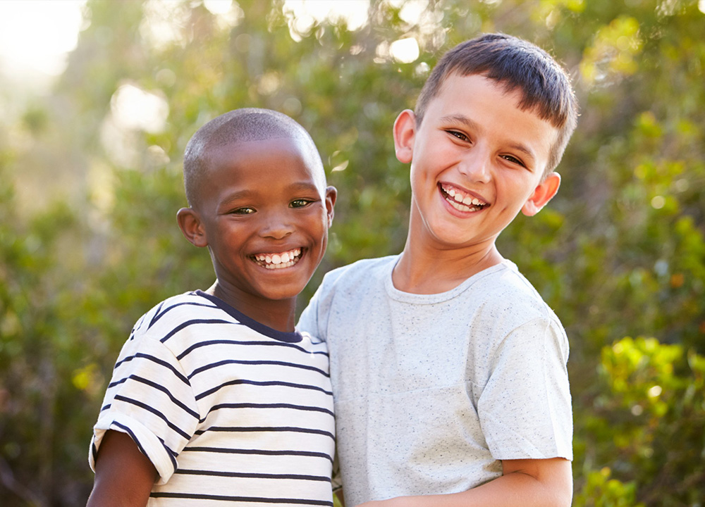 Two boys smiling.